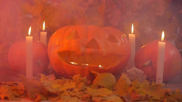 Glowing smoking monster pumpkin. Halloween concept