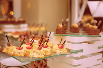 Light dessert a classic napoleon or millefeuille cake decorated with mint and strawberries on