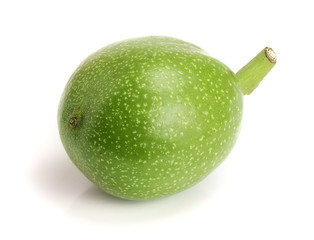 fresh walnut in peel isolated on white background