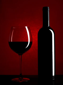 Red wine glass and wine bottle