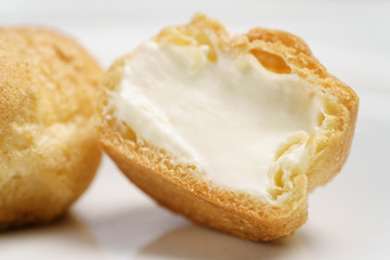 profiteroles on plate closeup one sliced