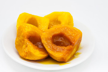 Chontaduro (Bactris gasipaes) with honey isolated on white background