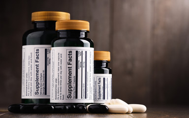 Composition with dietary supplement containers. Drug pills