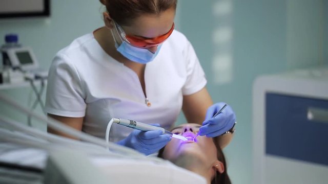 Dental restoration and material polymerization with UV light.