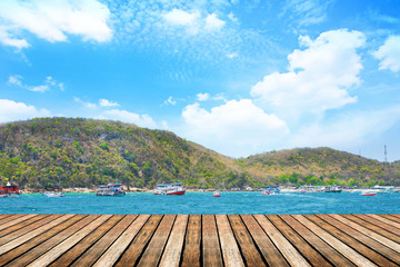 Wood bridge on the sea with many boat fishing