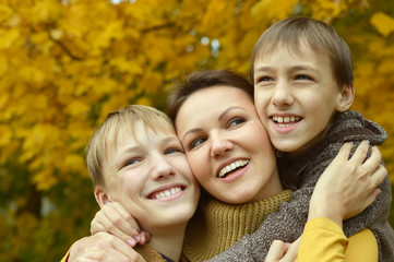 Fototapeta premium Mother and sons in park
