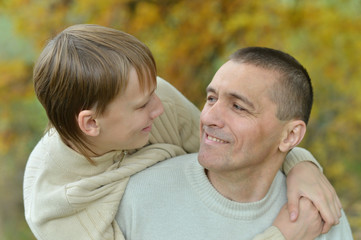 Fototapeta premium Father and son in autumn