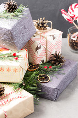 Christmas gifts, new year, holiday, bow, boxes, spruce branches, decorations, selective focus, vertical