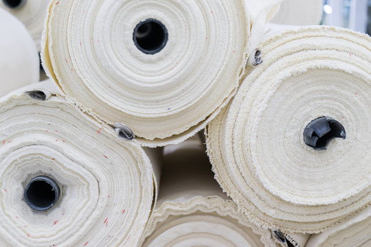 the fabric on the jeans factory. material for clothes in rolls