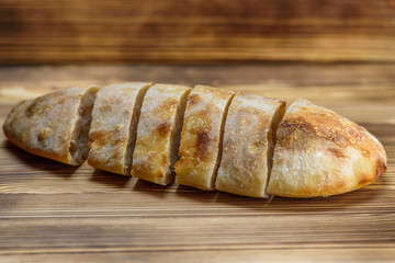 sliced homemade bread on a wooden background