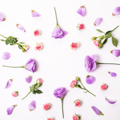 Flowers composition. Frame made Colorful eustoma flowers on white wooden background and free space for text at the top