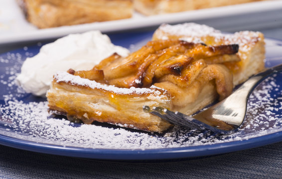 Rustic Apple Tart With An Apricot Glaze And Powdered Sugar