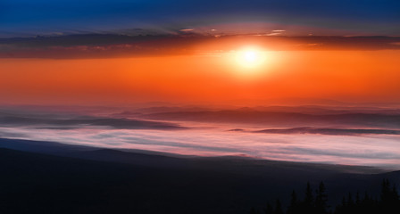 Fototapeta na wymiar peaceful landscape with mountain range scenic view and morning fog on sunrise