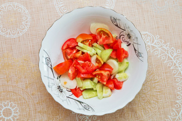 Tomato cucumber salad inside the trough / Azerbaijani salad