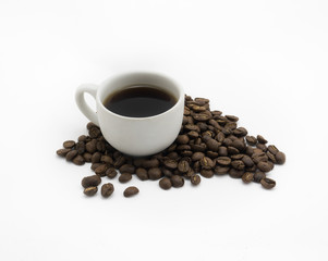Isolated Cup of coffee and dark roasted coffee beans on white background