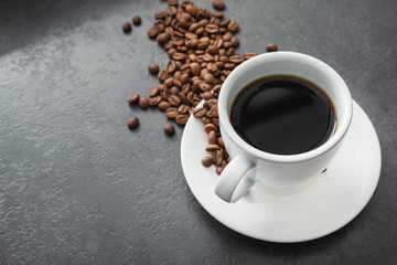 white cup with black coffee