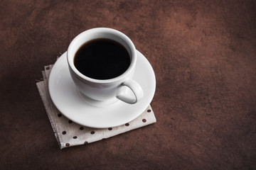 White coffee cup on napkin
