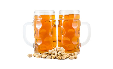 Two glasses of beer with pistachios on white.