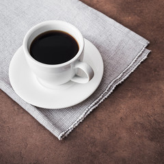 white ceramic cup with black coffee