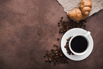 delicious croissant with a cup of coffee