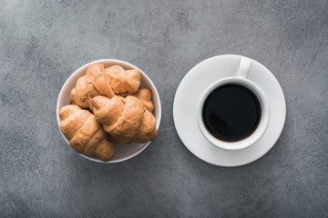 delicious croissant with a cup of coffee