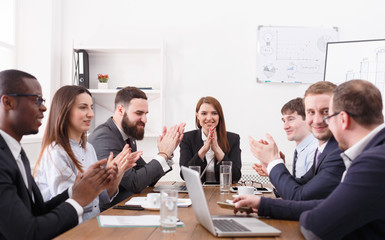 Business corporate meeting with female boss. Employees clapping hands cheering successful reporter