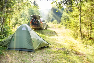 Gordijnen Cozy camping with tent and a car © Pavlo Vakhrushev