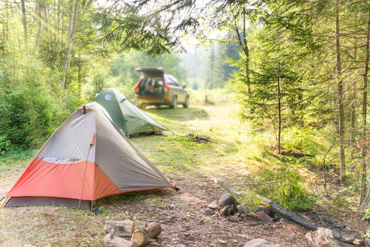Cozy camping with tents and a car