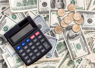 Calculator on the background of US dollar bills. Business concept.