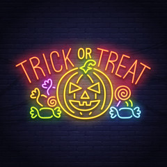 Trick or Treak. Pumpkin and candy neon sign. Happy Halloween. Neon sign, bright signboard, light banner. 