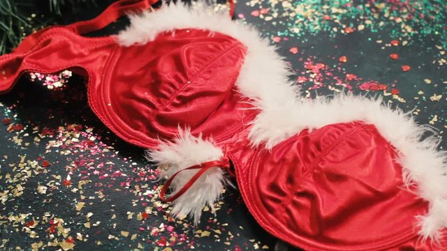 Part of Santa woman's mascot costume, top view in motion. Adult celebration and unusual presents concept