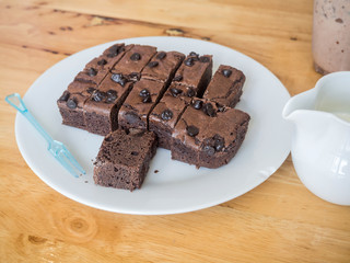 Cake chocolate brownies with fresh milk