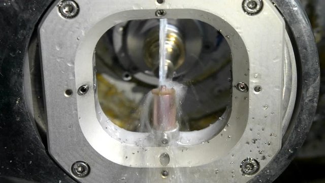 Milling abutment close-up. Cutting and milling of titanium abutment crown base for dental implant. Modern technology cad cam