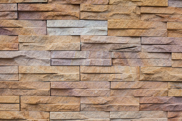 Sandstone brick wall texture background.