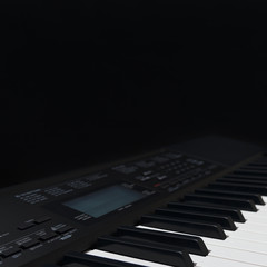 Synth on a black background close up