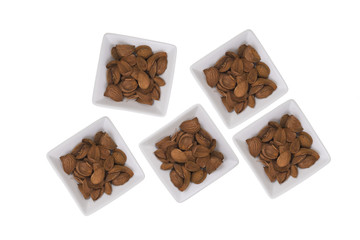 Almonds over white background. / Composition with almonds white pots over white background. Space for text