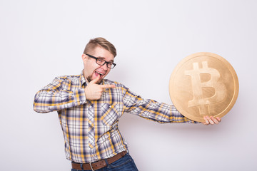 Crazy bitcoin lover with big golden coin, funny miner with coins.