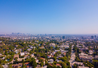 Panoramic aerial view on the Los Angeles from above. Clear blue sky. Hollywood sign district area