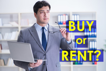 Businessman facing dilemma of buying versus renting