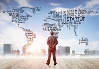 Motivation and inspiration concept with modern cityscape and businessman observing it