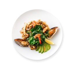 Warm salad with grilled seafood isolated