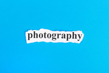 PHOTOGRAPHY text on paper. Word PHOTOGRAPHY on torn paper. Concept Image