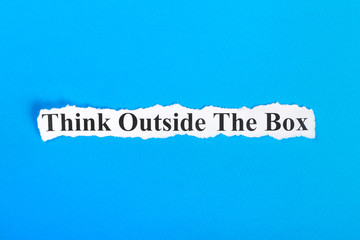 Naklejka premium Think Outside The Box text on paper. Word Think Outside The Box on torn paper. Concept Image