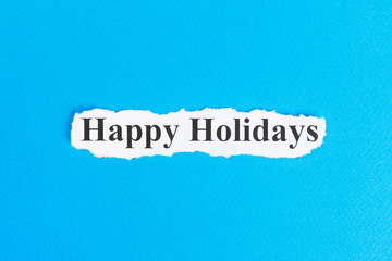 happy holidays text on paper. Word happy holidays on torn paper. Concept Image