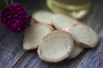 Ginger Slices and Bottle of Oil