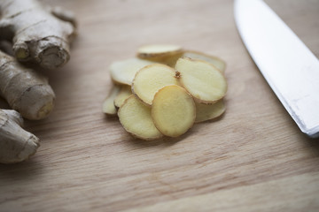 Close up Ginger Root Slices on Cutting Board