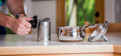 Preparing a meal by first opening a metal can