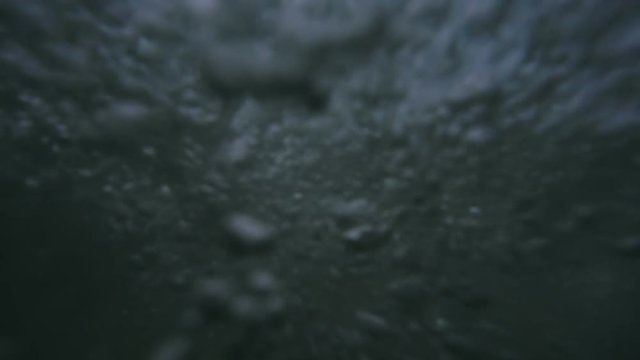 Waves on the ocean. The camera goes under water. Video recorded in slow motion. 