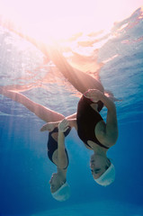 Underwater view of synchronized swimming duet