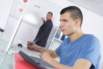 Fototapeta premium tutor near whiteboard screen giving lesson